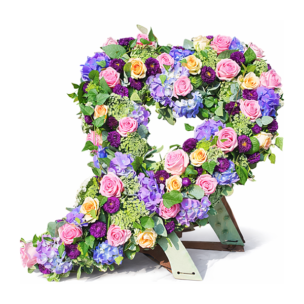 Ein wunderschönes Blumenherz aus Rosen und Hortensien für einen würdevollen Abschied in liebevoller Gestaltung.